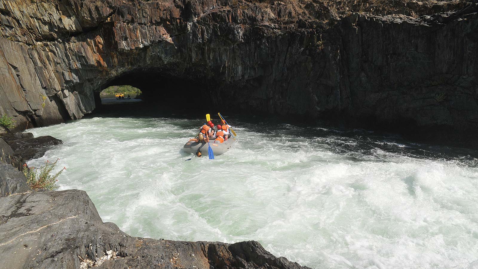 A paddle raft enters the Tunnel below Tunnel Chute rapid on the Middle Fork of the American River with ARTA River Trips