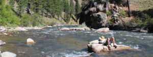A rafter takes a break along the Middle Fork of the Salmon in Idaho on a rafting trip