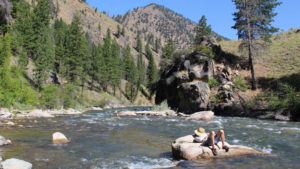 A rafter takes a break along the Middle Fork of the Salmon in Idaho on a rafting trip