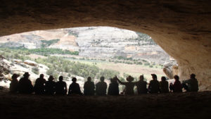 A group hangs out in Mantle Cave along the Yampa River