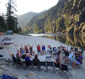 A group celebrates the arrival of dessert along the Main Salmon River in Idaho