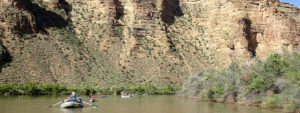 Rafts floating along the Green River deep in the heart of Desolation Canyon, Utah