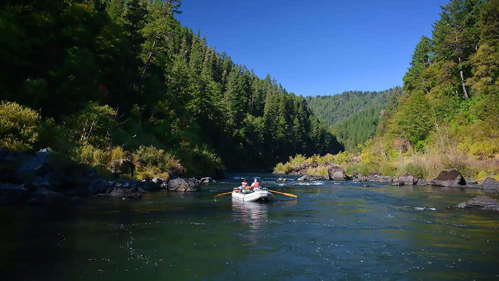 Floating on the river while whitewater rafting on the Rogue River in Oregon with ARTA river trips