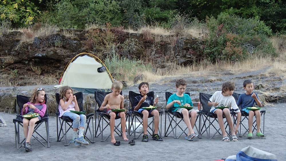 The kid’s table while whitewater rafting on the Rogue River in Oregon with ARTA river trips