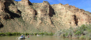 rafts floating downstream on the Green River in Desolation Canyon