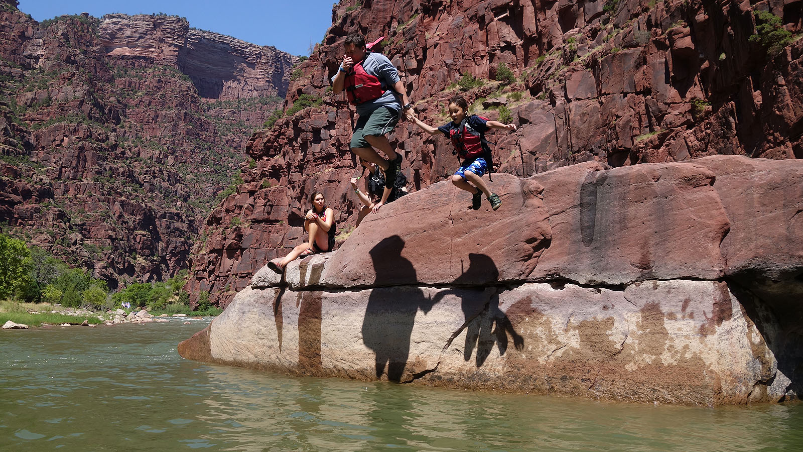 Jumping off of a rock into the Green River in Dinosaur National Monument