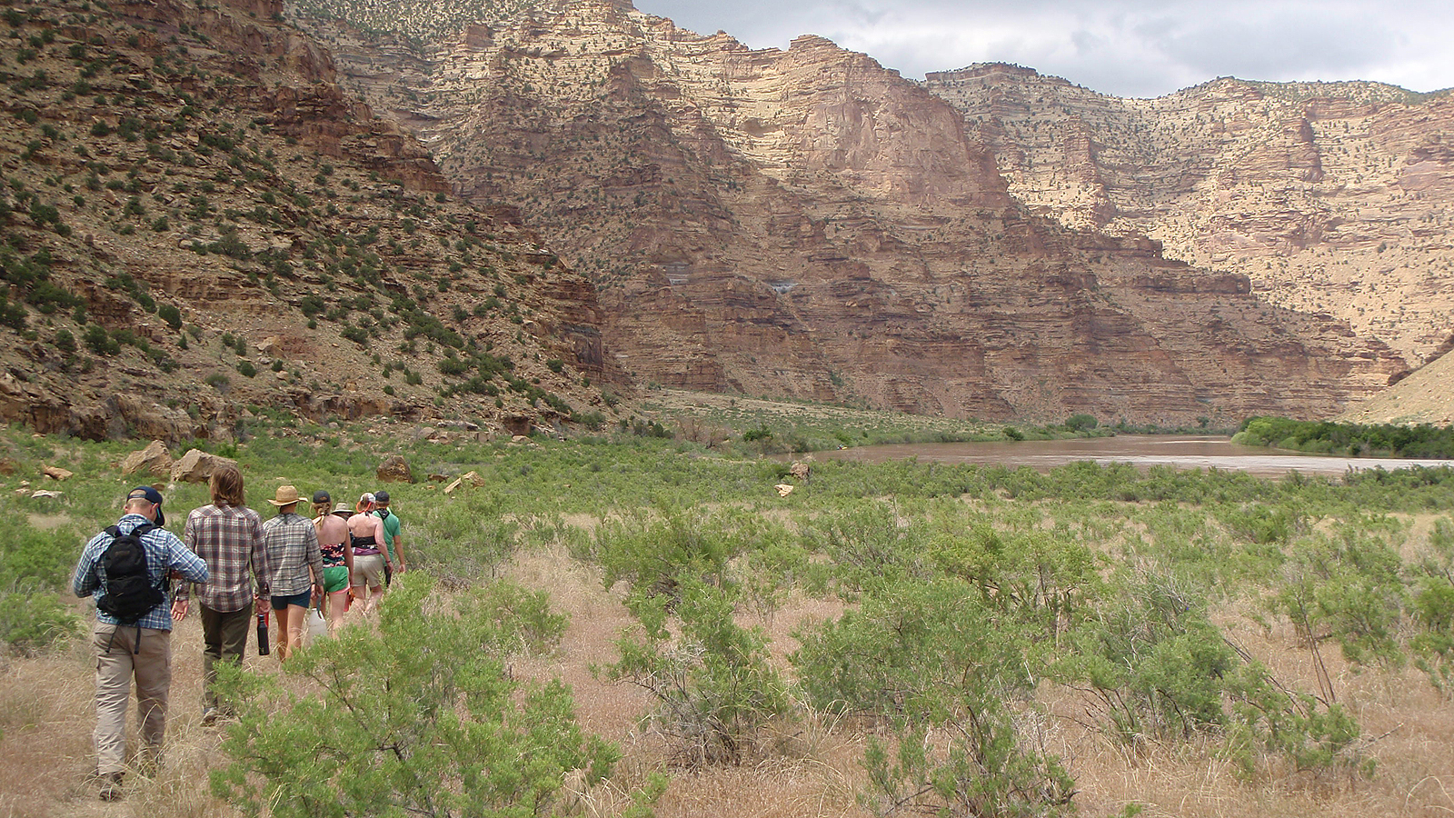 A group hikes along the Green River in Desolation Canyon