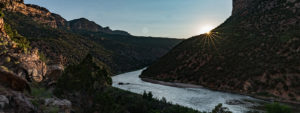 The sun peaks over the rim in the Yampa River Canyon in Dinosaur National Monument