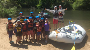 A group prepares to launch on the South Fork of the American River