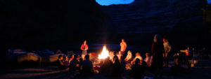 A group enjoys an evening campfire along the Yampa River in Dinosaur National Monument