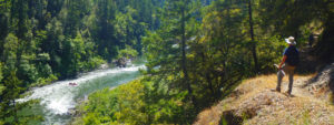 A hiker makes his way along the Rogue River Trail in Southern Oregon with ARTA River Trips