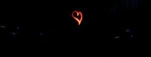 headlamp heart art along the river