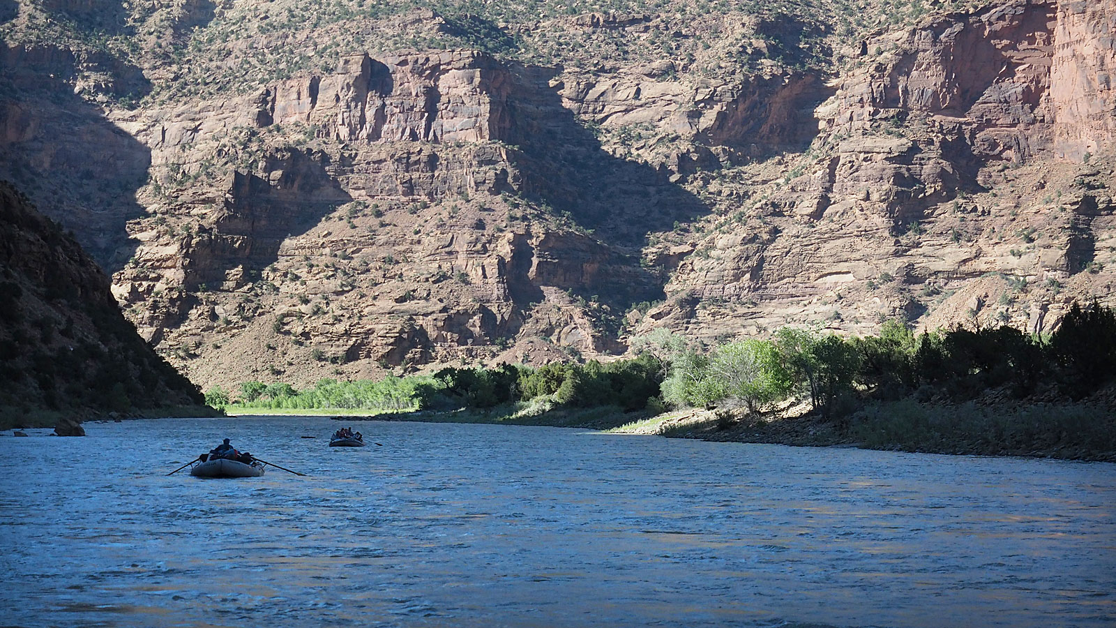 Rafts floating on the Green River in Desolation Canyon in Utah during a whitewater rafting trip with ARTA River Trips