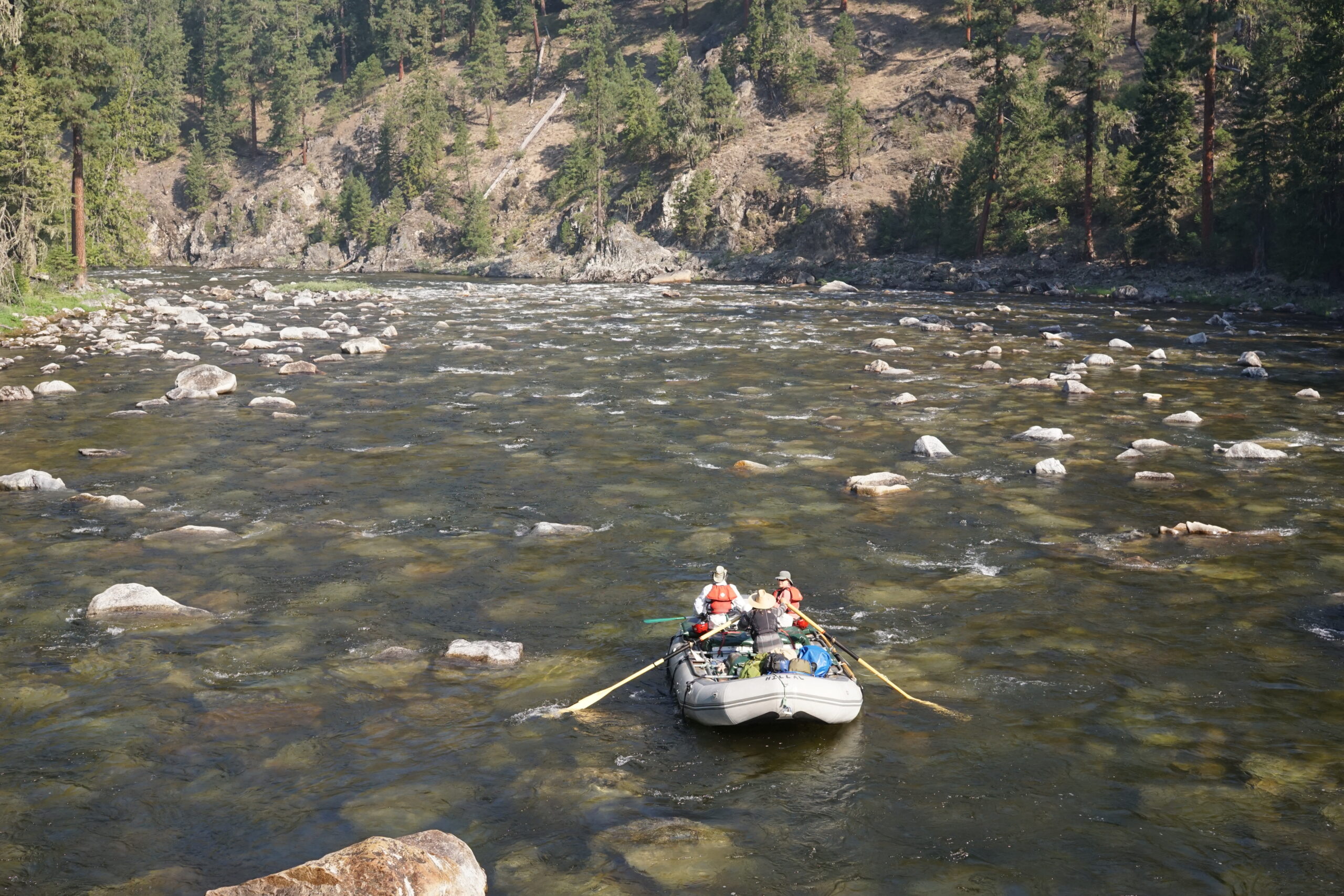 A raft paddles down the scenic and rocky selway river