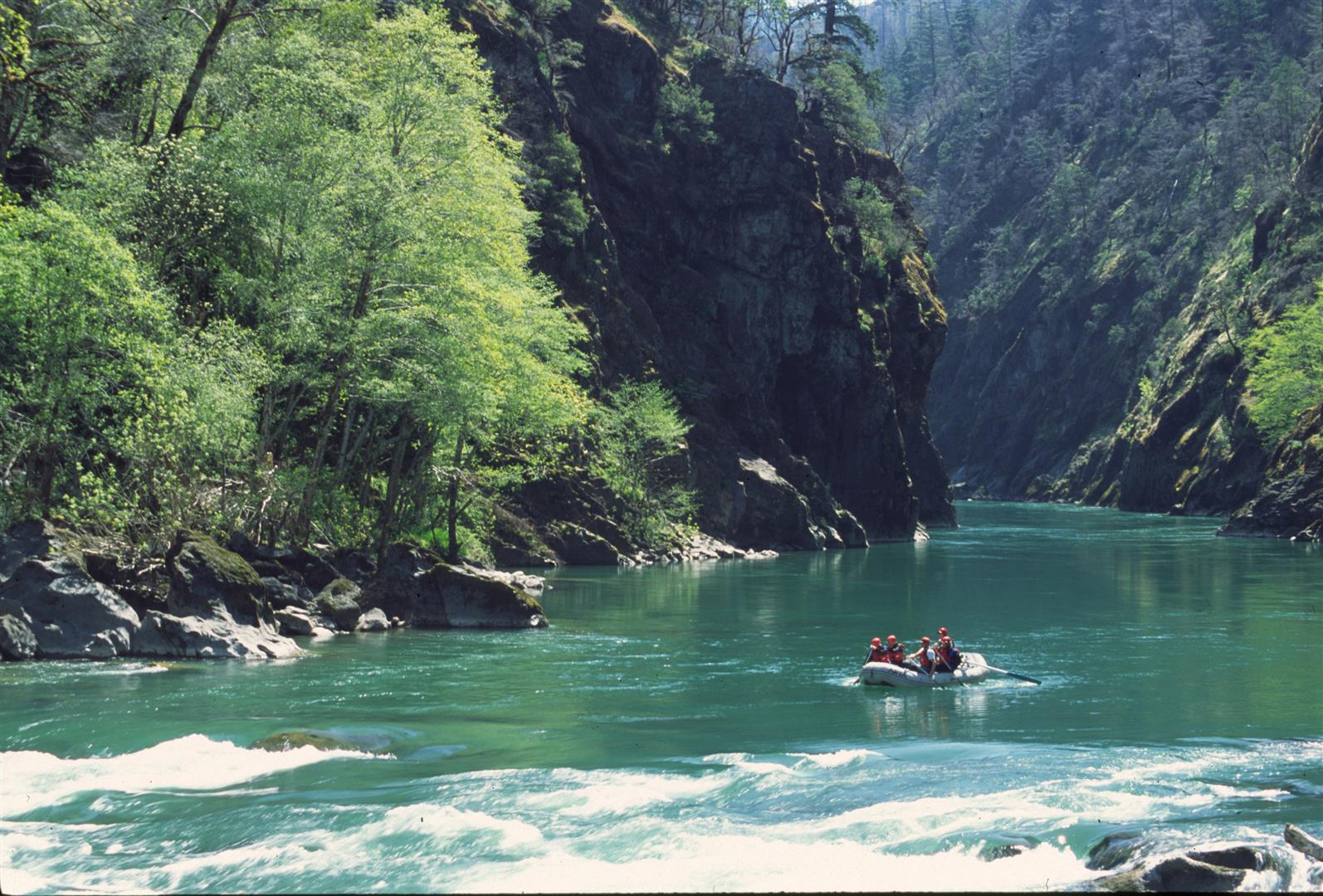 A raft paddles down the scenic and blue illinois river