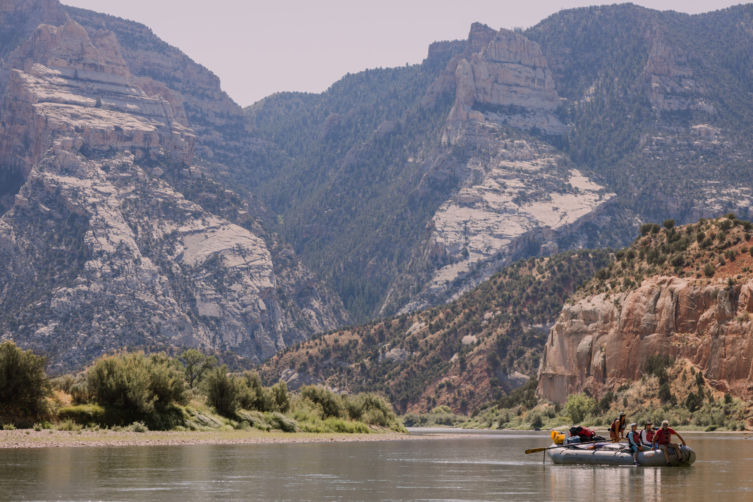 A boat floats down Lodore canyon on the green river