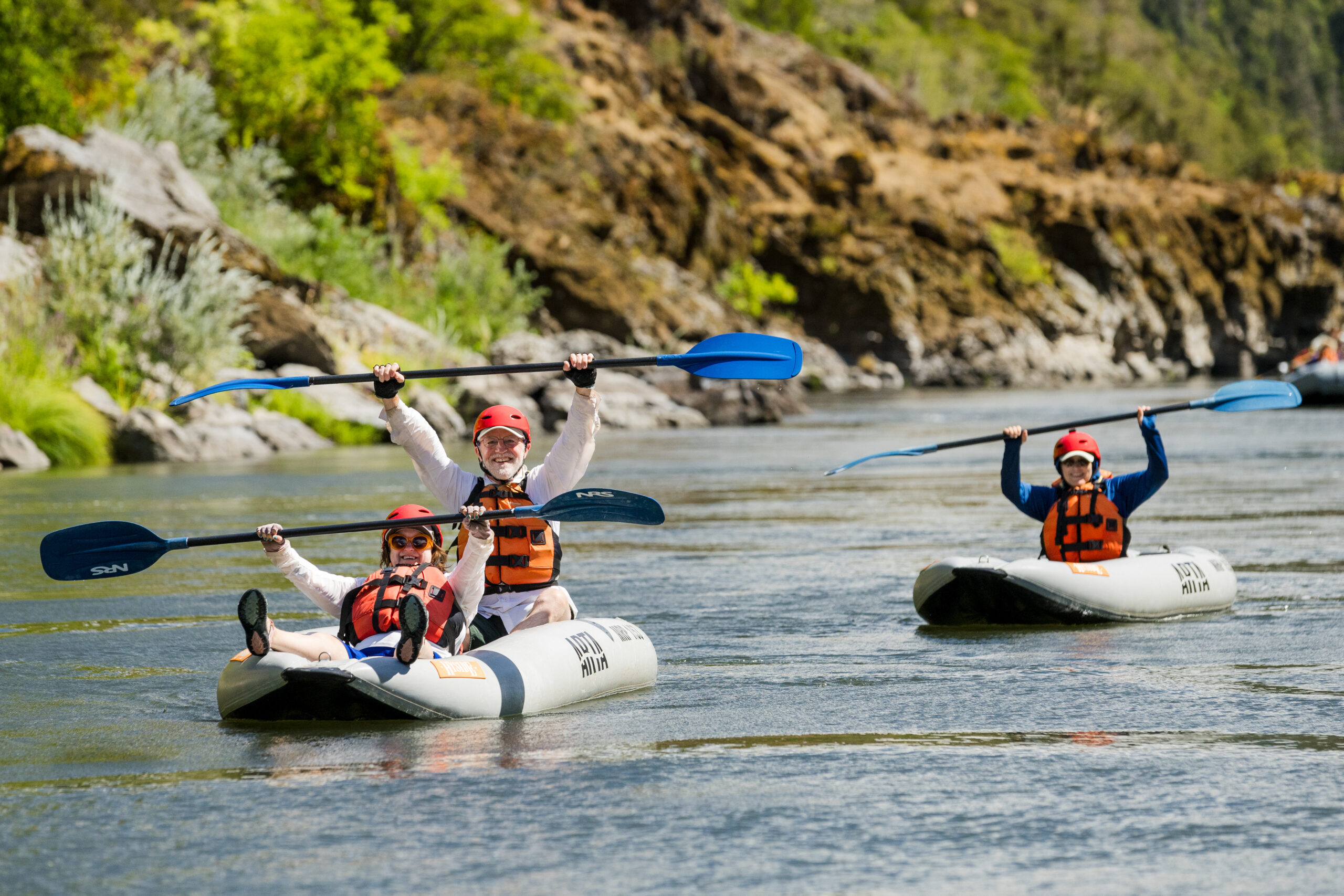 People in inflatable kayaks on the rogue river