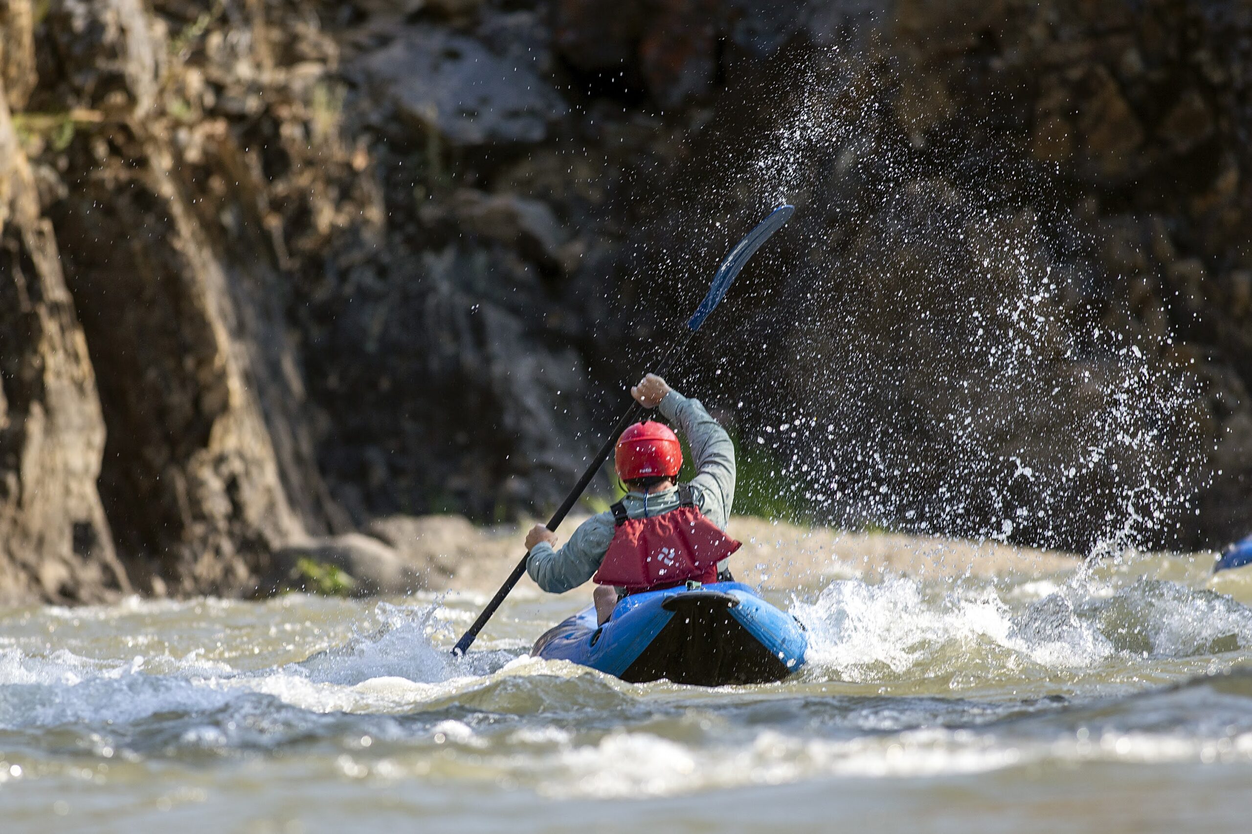 A kayak paddles through the green river's lodore canyon