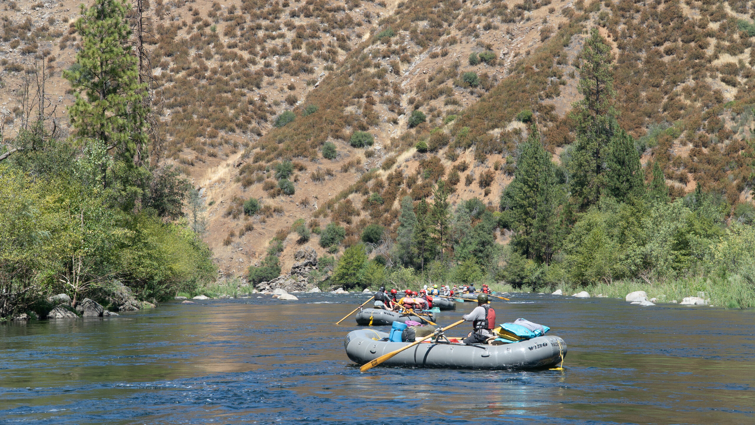 grey boats float down the river
