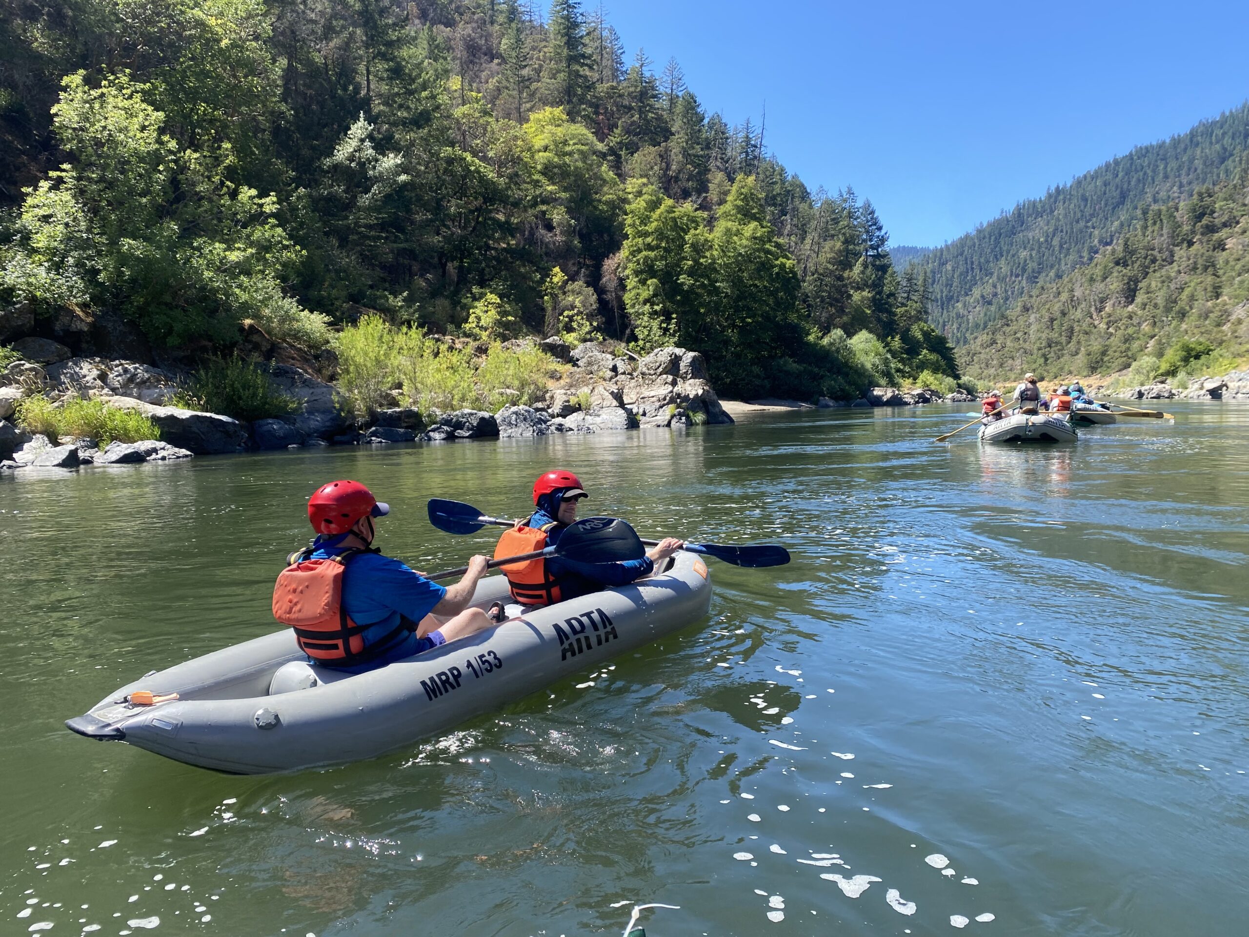 People on the rogue river in an inflatable kayak
