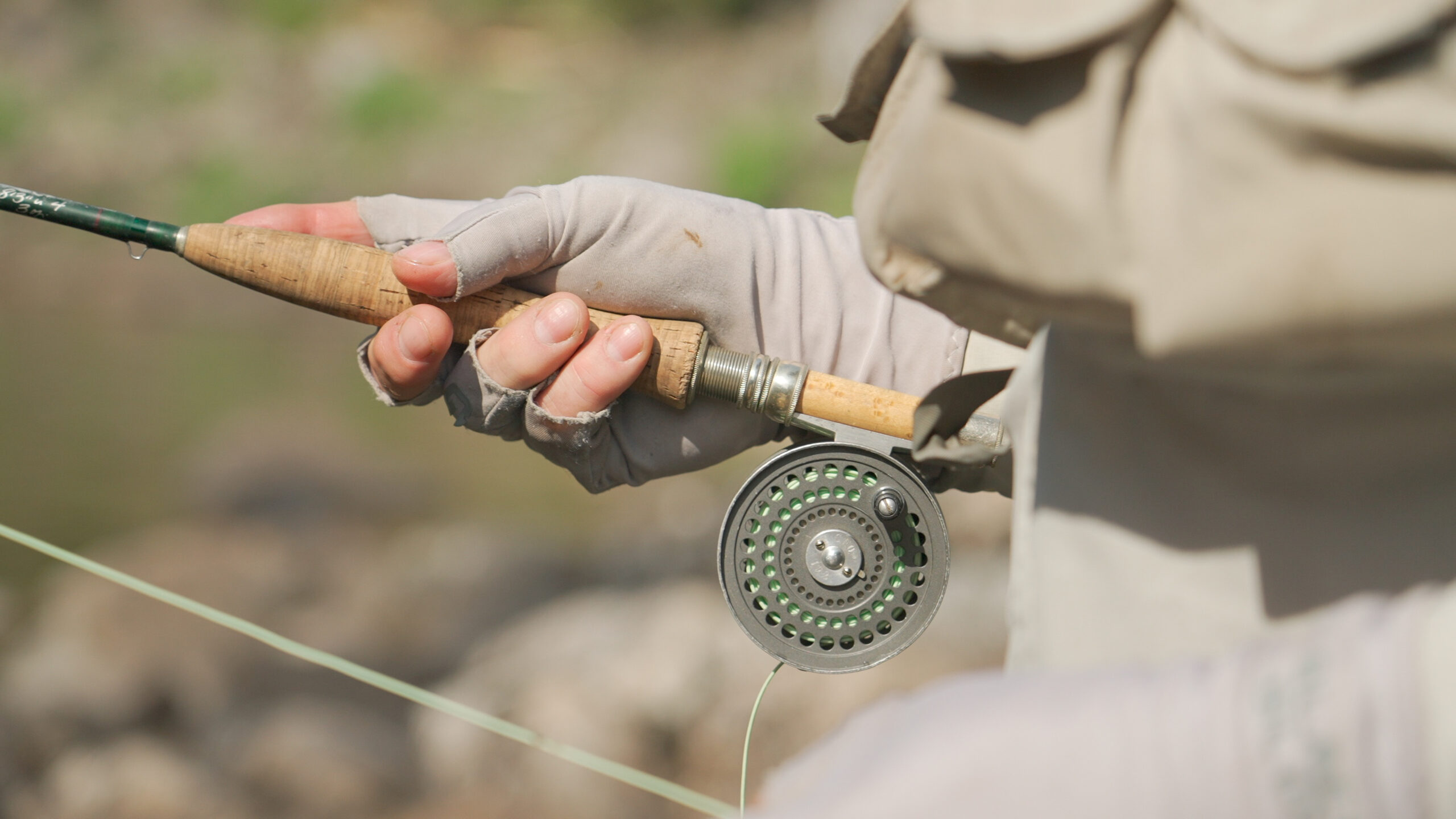 A person holding a fishing rod